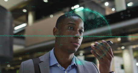 Image of data processing over african american businessman talking on smartphone