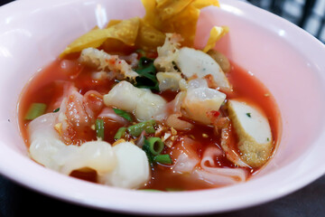 noodles with fish ball , jellyfish and fried wonton
