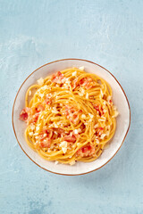 Carbonara pasta dish, traditional spaghetti with pancetta and cheese, shot from the top