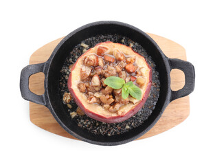Tasty baked apple with nuts, honey and mint in baking dish isolated on white, top view