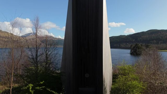 An Ceann Mor Inveruglas pyramind in soctland with view of Ben Lomond peak