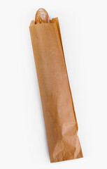 Fresh baguette in a paper bag on white background