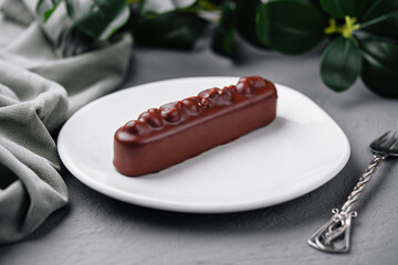 Elegant chocolate bar dessert on white plate