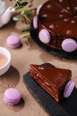Decadent chocolate layer cake with macarons