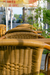 Wicker chairs on the terrace in a cafe.
