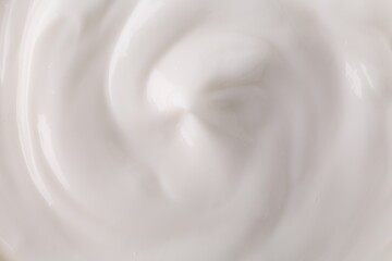 Texture of body care cream as background, top view