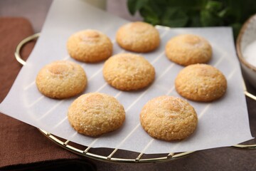 Tasty sweet sugar cookies on brown table, closeup