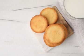 Tasty sweet sugar cookies on white wooden table, top view. Space for text