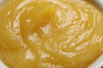 Delicious lemon curd in bowl, closeup view