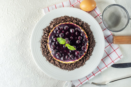 Top view of piece of sweet dessert on small dish plate for serve like chocolate strawberry cheesecake custard waffle and ice cream with berries on white mulberry paper.