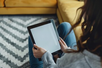 App mockup shoulder view of a teen girl holding a tablet with a fully grey screen
