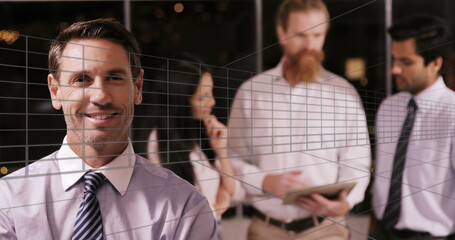 Image of tunnel in seamless pattern over caucasian businessman smiling at office