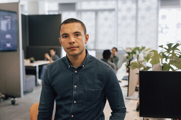 Portrait of a new employee in a modern corporate office