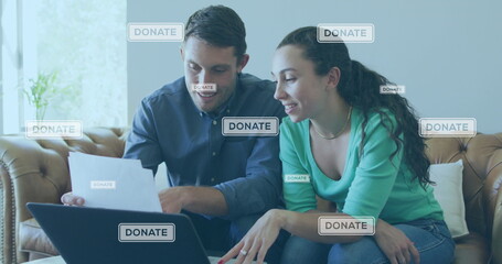 Image of donate texts over caucasian couple using laptop