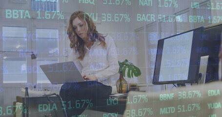 Image of statistics and data processing over caucasian businesswoman using computer
