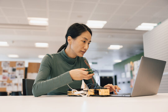 Woman using artificial intelligence for robotic technology