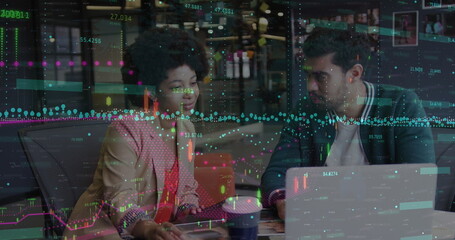 Fototapeta na wymiar Image of financial data processing over diverse man and woman discussing over laptop at office