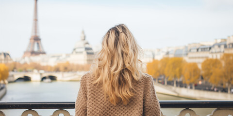 woman on the bridge.A woman examines the city. A walk around Paris. Tourism, travel