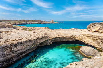 The famous Grotta della Poesia, cave with turquoise water in Puglia, Italy