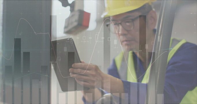 Image of statistic charts over asian male worker in warehouse - Powered by Adobe