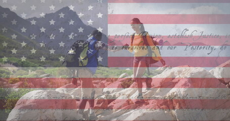 Image of american flag and text moving over couple hiking