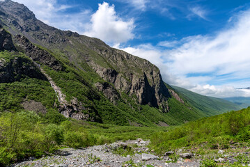 Fototapeta premium Beautiful panoramic view of Midagrabin waterfalls in summer, North Ossetia, Russia.