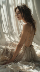 Serene beauty in backlit sheer gown seated