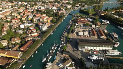 Fototapeta na wymiar Aerial view of the city of Peschiera del Garda, Verona, Veneto. Top view of the canal with yachts