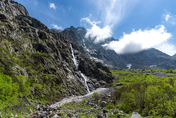 Fototapeta na wymiar Beautiful panoramic view of Midagrabin waterfalls in summer, North Ossetia, Russia.