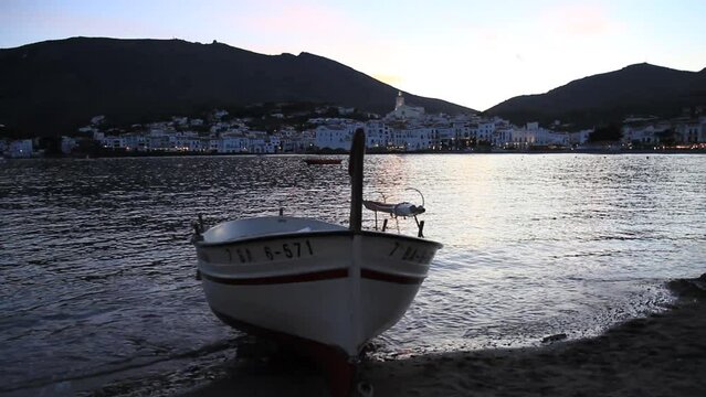 Landscape of the bay of Cadaqués at sunset from a small cove. Traditional fishing village of the Costa Brava. Cap de Creus Natural Park, Alt Empordar, Catalonia, Spain