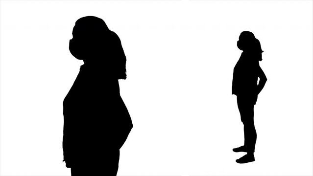 Isolated Woman Silhouette Profile New Normal Face Mask. Silhouette of a woman wearing a face mask protection. Full body and medium shot