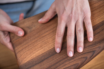 Female hand with elegant unique wooden handcrafted item