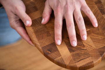 Female hand with elegant unique wooden handcrafted item