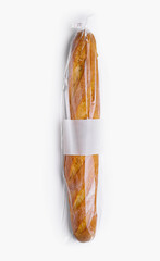 Fresh baguette in plastic wrap isolated on white