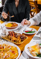Friends enjoying a feast at a restaurant