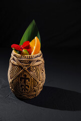 Exotic tiki cocktail mug with tropical garnish