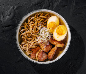 Savory ramen bowl with eggs and pork