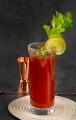 Bloody Mary cocktail in a glass with celery sticks
