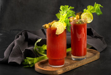 Bloody Mary cocktail in a glass with celery sticks