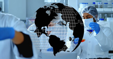 Image of globe over group of diverse scientists in lab