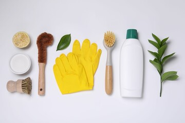 Flat lay composition with different cleaning supplies on white background
