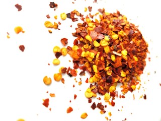 Chilli flakes on a white background.