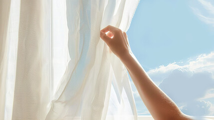 Fototapeta na wymiar Woman hand pulling white transparent curtain aside. Blue sky bright sunlight
