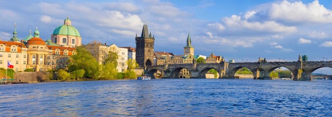 Panorama of old town with Charles Bridge on Vltava river and Old Town Bridge Tower, famous tourist destination in Prague, Czech Republic - obrazy, fototapety, plakaty