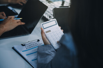 Finance manager meeting discussing company growth project success financial statistics, professional investor working start up project for strategy plan with document, laptop and digital tablet.