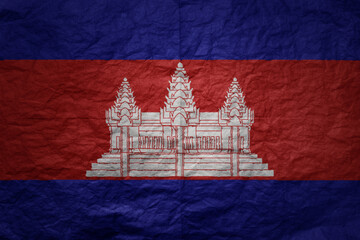 big national flag of cambodia on a grunge old paper texture background