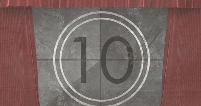 Fototapeta Image of movie vintage countdown in circle over brown curtains