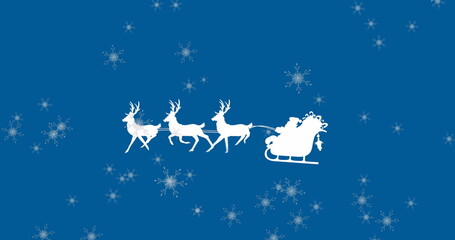 Obraz na płótnie Canvas Image of santa claus in sleigh with reindeer over snow falling on blue background