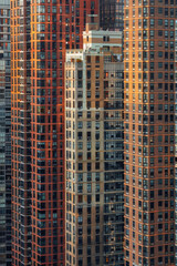 Naklejka premium A closeup of skyscrapers in a city using a telephoto lens