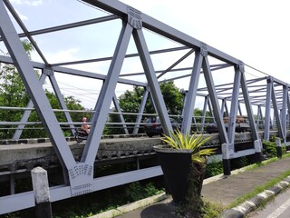 The splendor of the Solo bacem bridge which was built over the largest river in Central Java,...